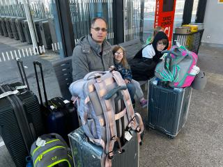 This is us after our flight, train ride, and figuring out where to go. We are all exhausted and short on patience, as I think you can tell from our overly tired teen 🤣.