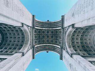 The Arc de Triomphe is an iconic landmark.
It's a lot of fun to photograph due to the symmetry and repeated patterns.
It's also a stair stepper from the first level of Hades.