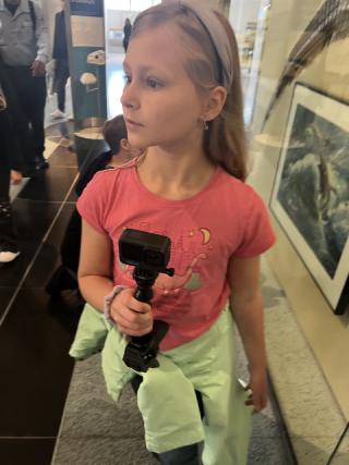 Karis vlogging at the New York Natural History Mueseum.