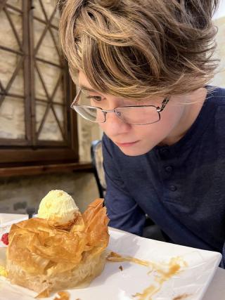 Karsten transfixed by his desert. It was an apple pie and so flaky.